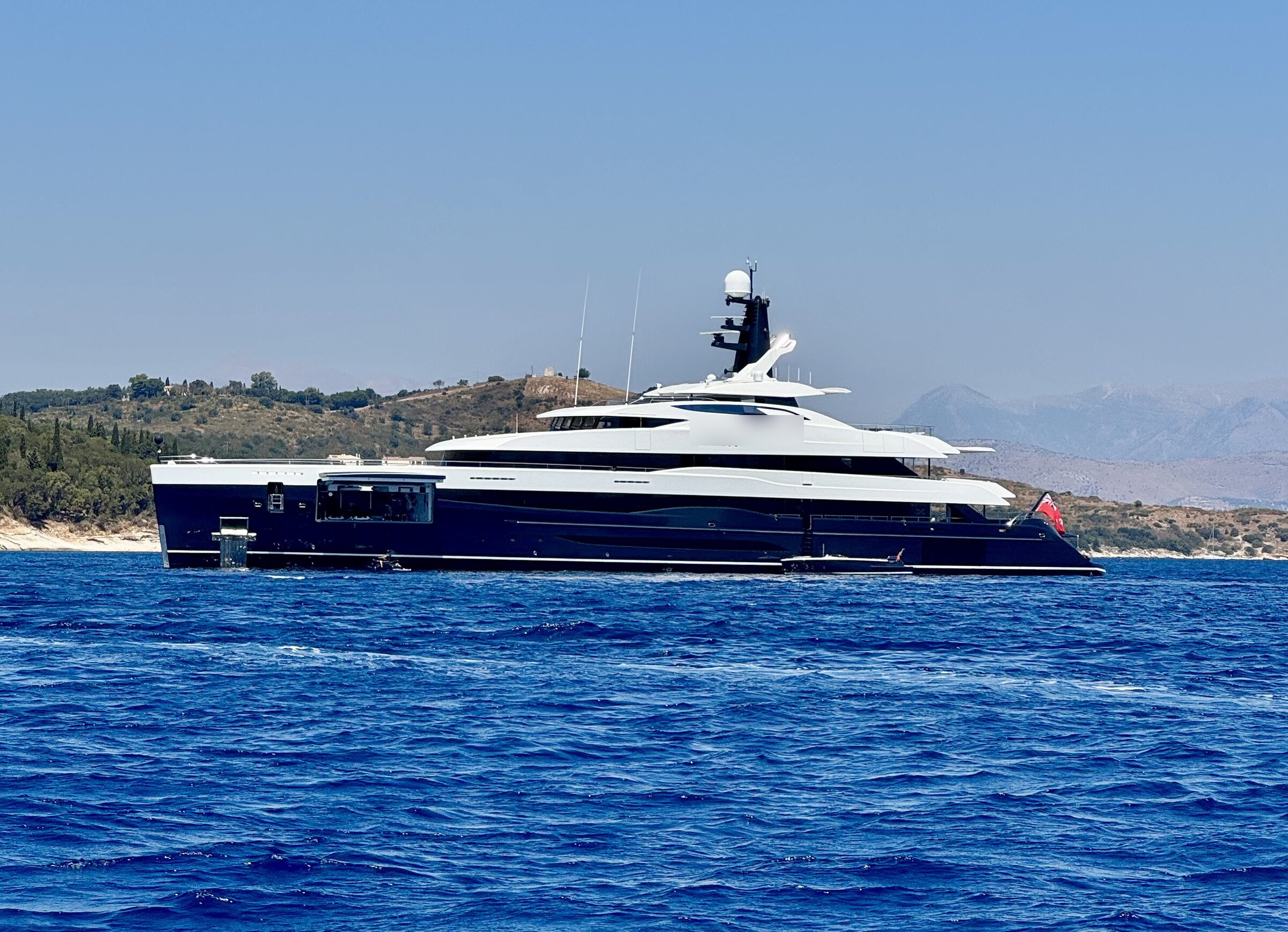 Superyacht at anchor off the Corfu coastline, Ionian Sea